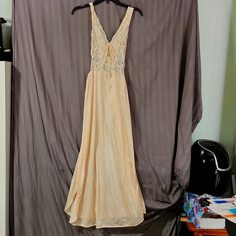Long , nylon peach nightgown with v lace top and side suits. Size medium
